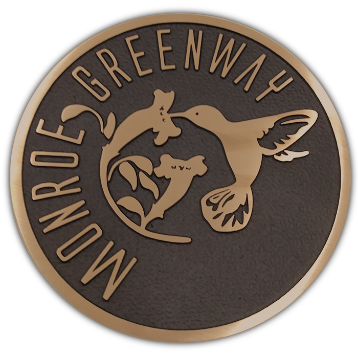Bronze emblem from Monroe's greenway